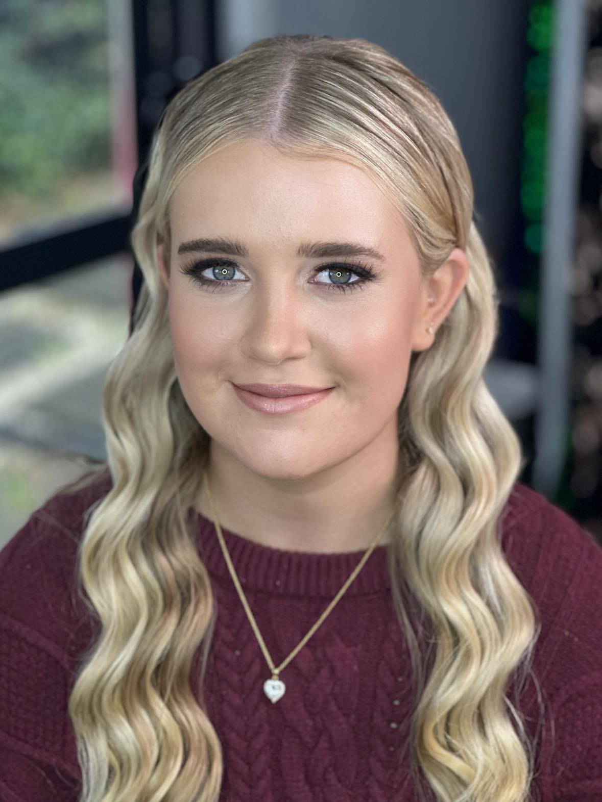A diverse range of models of different ages showcasing beautiful, naturally glowing makeup. The models, including young adults, middle-aged individuals, and sen