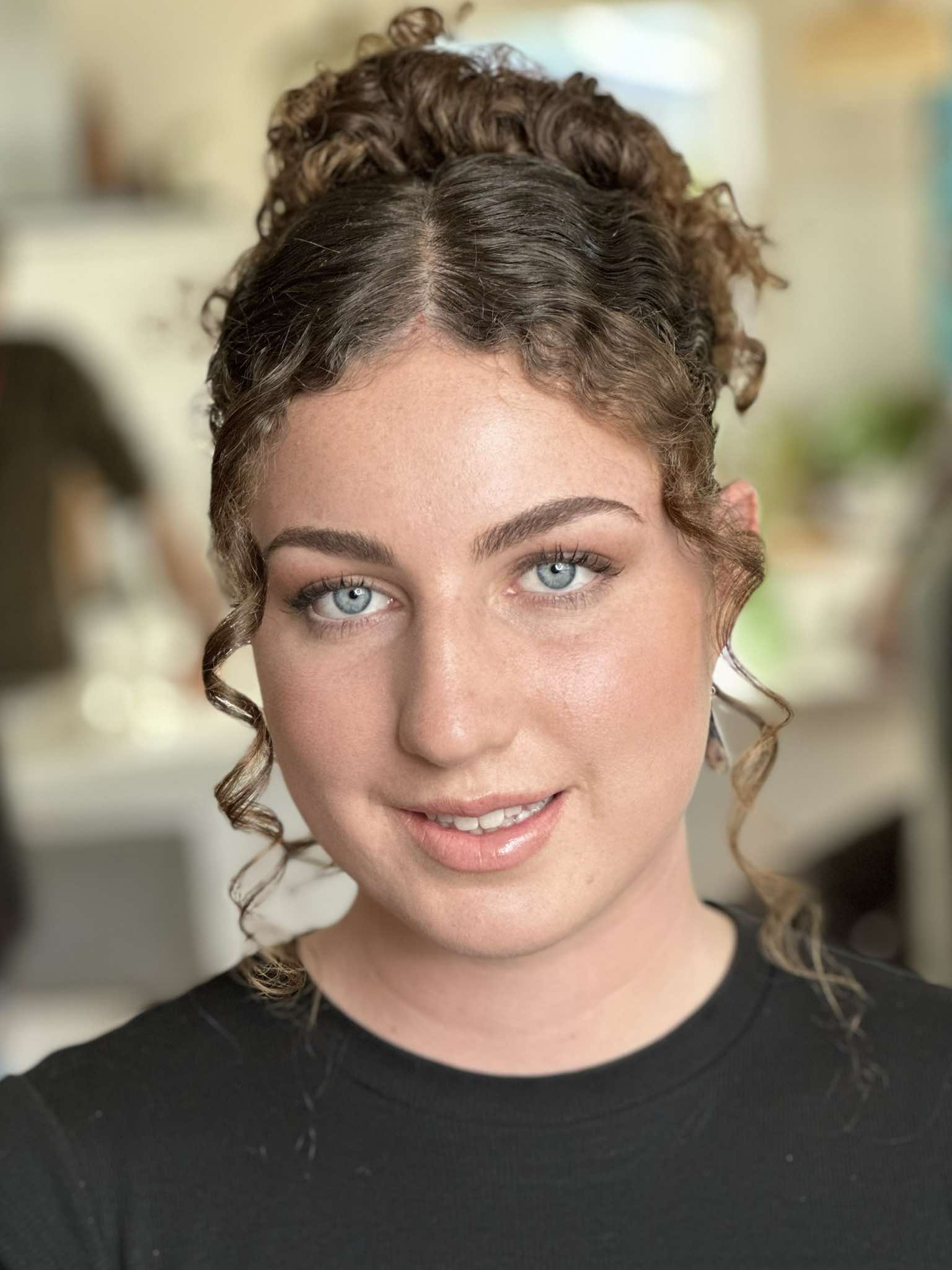 A diverse range of models of different ages showcasing beautiful, naturally glowing makeup. The models, including young adults, middle-aged individuals, and sen